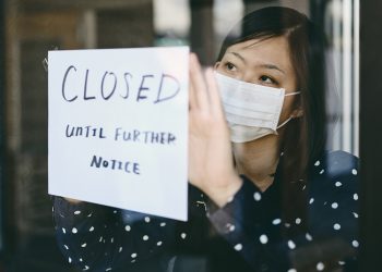 An Asian woman small business owner affected by the COVID-19 virus.