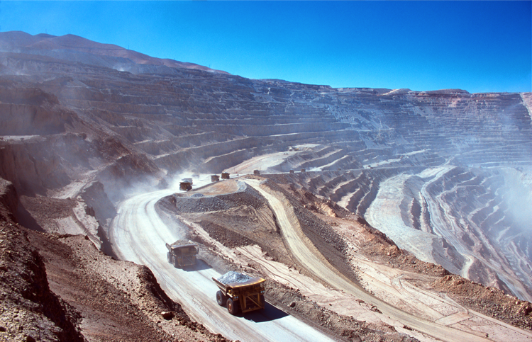 Ore trucks in an open-pit mine