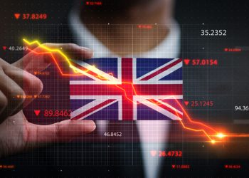 Graph Falling Down in Front Of United Kingdom Flag. Crisis Concept