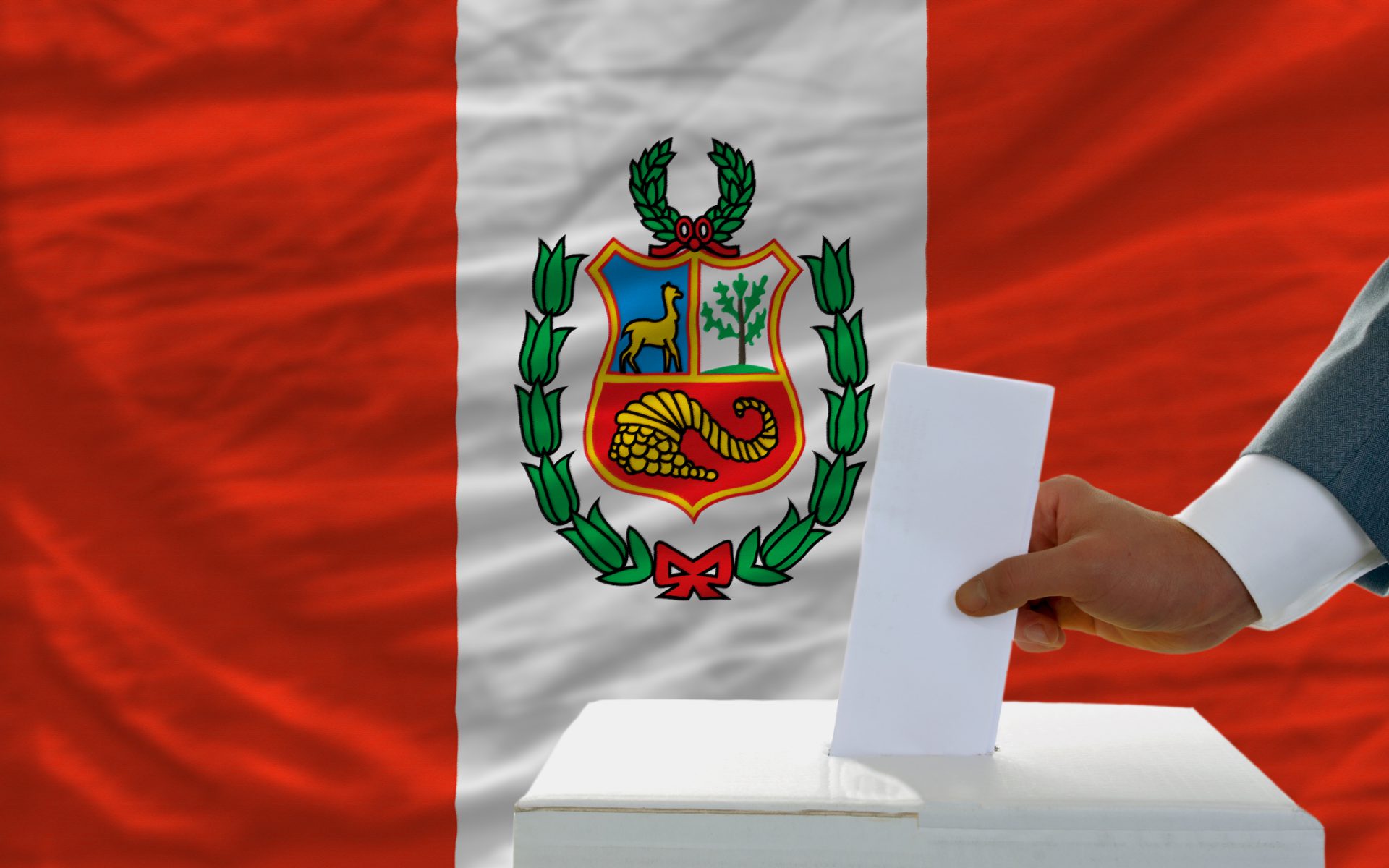 man voting on elections in peru front of flag