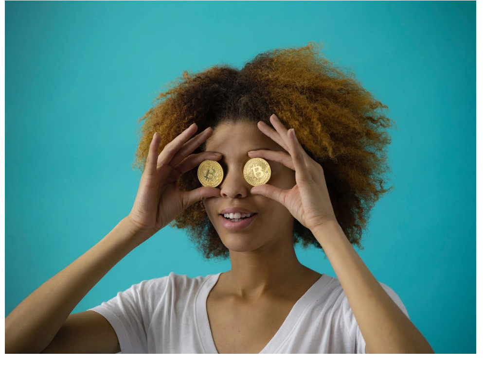 Woman Holding Two Coins