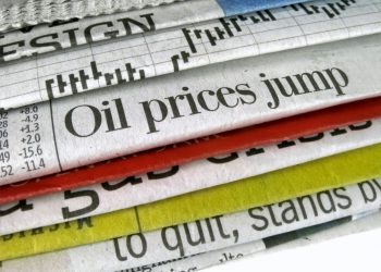 Newspaper headline "Oil prices jump"