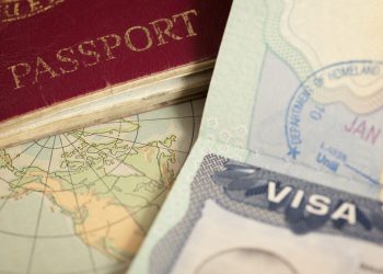 "US visa, vintage map and passport background"