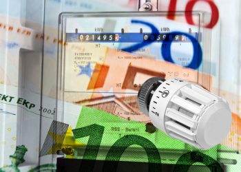 Electricity meter and heating valve energy costs with euro banknotes concept abstract