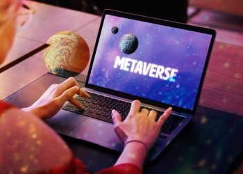 Metaverse concept.Woman using laptop with planet screen