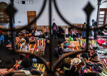 Refugees from Ukraine who arrived to Krakow due to ongoing Russian military invasion are seen at a temporary shelter inside the reception point organized in a former historic building of railway station in Krakow, Poland on March 7, 2022. Russian invasion on Ukraine causes a mass exodus of refugees to Poland. (Photo by Beata Zawrzel/NurPhoto via Getty Images)