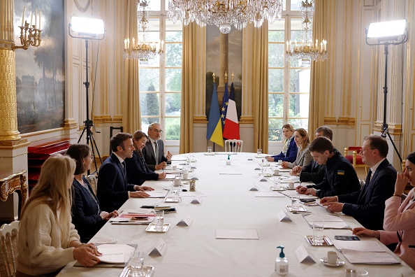 French President Emmanuel Macron (3rdL) meets with Melitopol City Mayor Ivan Fedorov (3rdR) from Ukraine at the Elysee Palace in Paris, on April 1, 2022. - On 11 March 2022, Ivan Fedorov was detained and questioned for 5 days by Russian army amid the conflict in Ukraine. (Photo by Yoan VALAT / POOL / AFP) (Photo by YOAN VALAT/POOL/AFP via Getty Images)