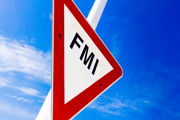 Warning traffic sign with the acronym IMF against blue sky