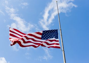 United States flag flying at a half-staff