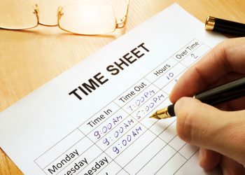 Records work hours in a time sheet.