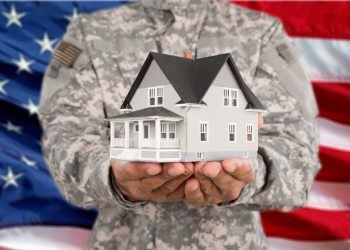 Military man Holding House Model, Real Estate Concept