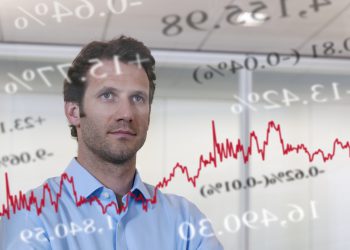 Businessman looking at financial market data