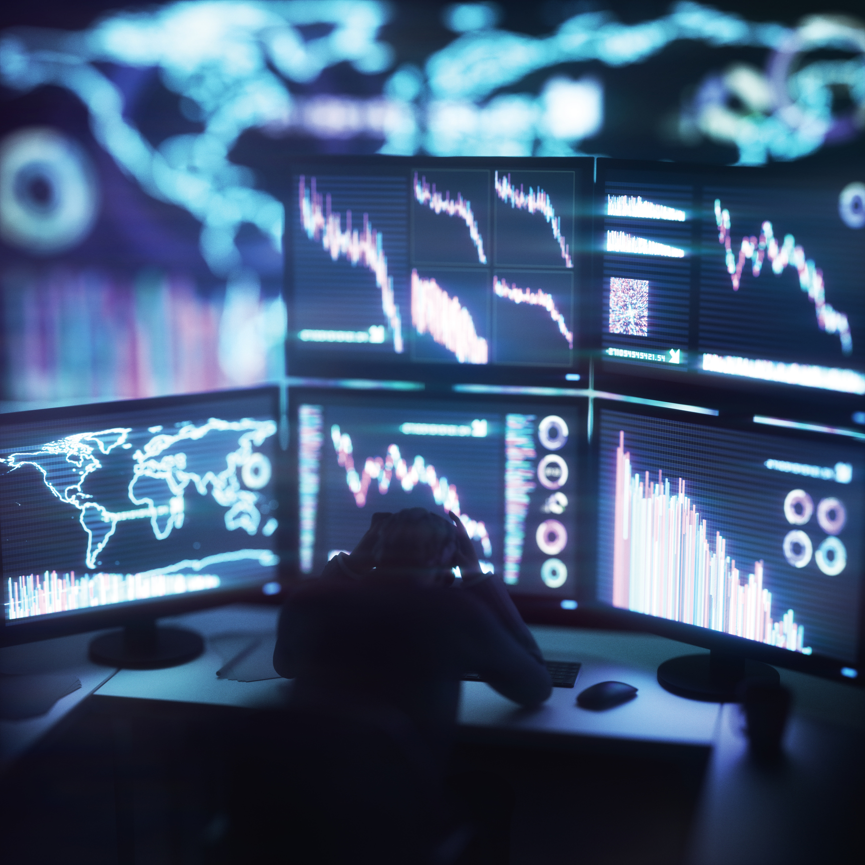 Illustration of man watching on monitors showing falling stock markets. Computer generated image.