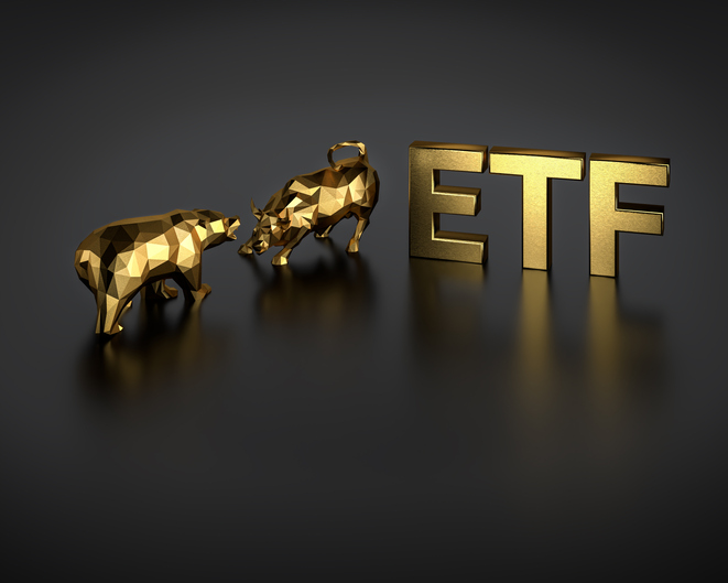 Exchange traded fund concept. A bull and bear besides the golden text ETF.