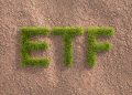 Green grass letters ETF in an arid landscape. Concept for Exchange traded funds investing by ESG standards (environment social governance).