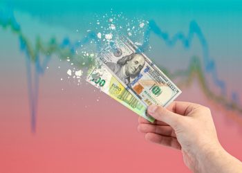 Inflation, hyperinflation, stagflation. One hundred dollar and one hundred euro banknotes splatter on the falling red graph. The concept of inflation and crisis in Europe and the United States