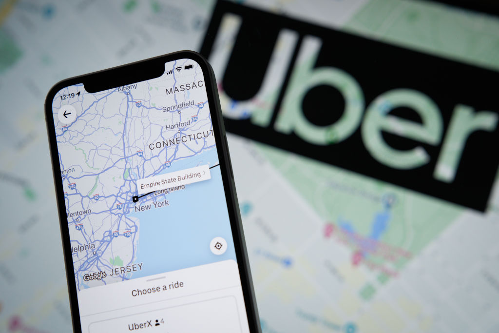 The Uber app application with a map of New York City is seen on an Apple iPhone mobile phone in this photo illustration Warsaw, Poland on 21 September, 2022. (Photo by STR/NurPhoto via Getty Images)