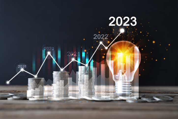 Light bulbs on and arrows pointing up, the idea begins with a new invention. Get creative with new investments or jobs in 2023.