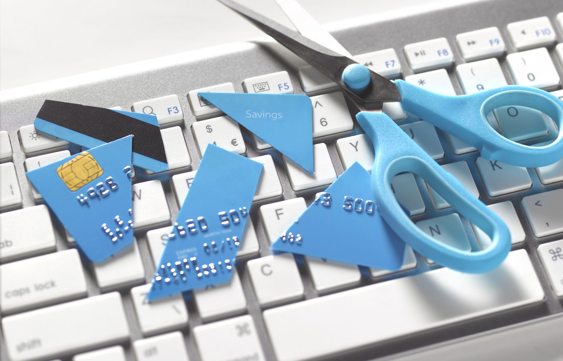 SCISSORS AND CUT UP CREDIT CARD, TO PREVENT OVERSPENDING ONLINE