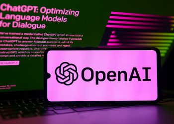 ChatGPT and OpenAI emblems are displayed on a mobile phone screen with ChatGPT website in a background for illustration photo. Gliwice, Poland on February 21st, 2023. (Photo by Beata Zawrzel/NurPhoto via Getty Images)