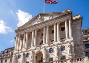 A Union flag flying over the Bank of England, the central bank of the United Kingdom, located on Threadneedle Street in the City of London.