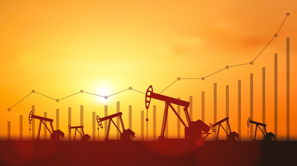 Up trend line graph and Silhouette Oil pumps at oil field with sunset sky background