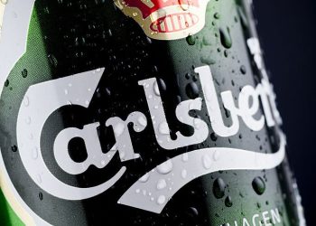 Stockholm, Sweden - June 30, 2011: Wet Carlsberg Hof Beer Can On Dark Background. Carlsberg Hof is a danish pilsner beer. The beer is produced by Carlsberg A/S, founded 1847 in Copenhagen.