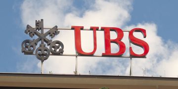 "Zurich, Switzerland - July 8, 2011: UBS company logo on the rooftop of the bank's headquarter office building in Zurich, Paradeplatz."