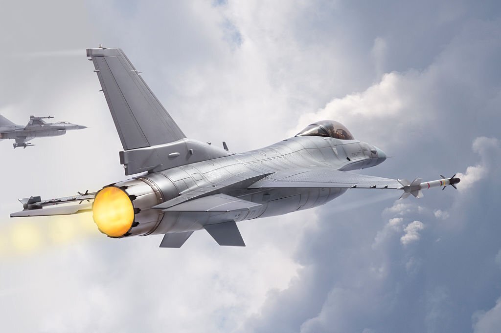 F-16 Fighting Falcon military jets (models) fly through clouds