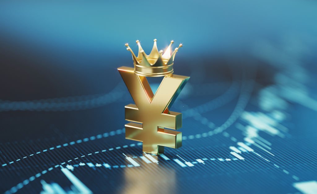 Yen sign wearing gold crown sitting over blue financial chart. Horizontal composition with selective focus and copy space. Finance and stock market concept.
