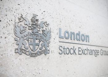 London, United Kingdom - April 24, 2011: London Stock Exchange Group logo, side view, selective focus on the coat of arms. Located in the City of London, at Paternoster Square, the London Stock Exchange was founded in 1801. It is the fourth-largest stock exchange worldwide.